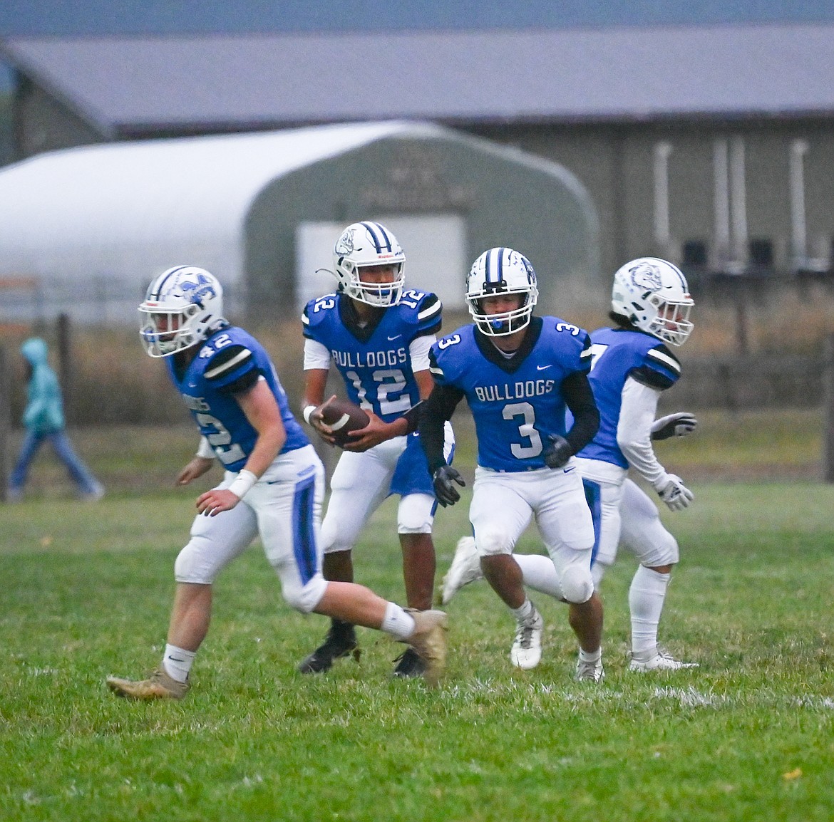 Quarterback Vinny Shepard prepares to make a play during last Friday's game against Darby. Mission won 58-28, despite a fierce wind storm that knocked out power during the game. (Christa Umphrey photo)