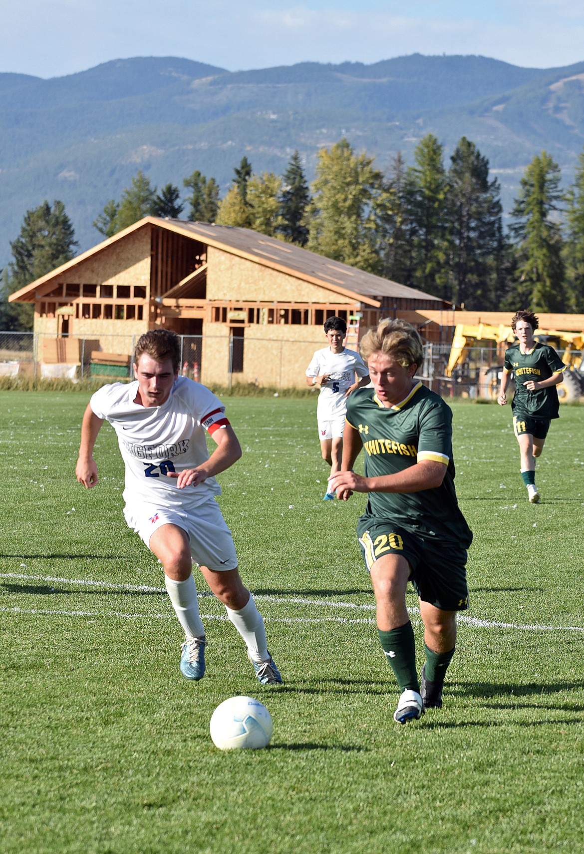 Bulldog Henry Barbieri races for the ball in the penalty box at the homecoming game last week. (Julie Engler/Whitefish Pilot)