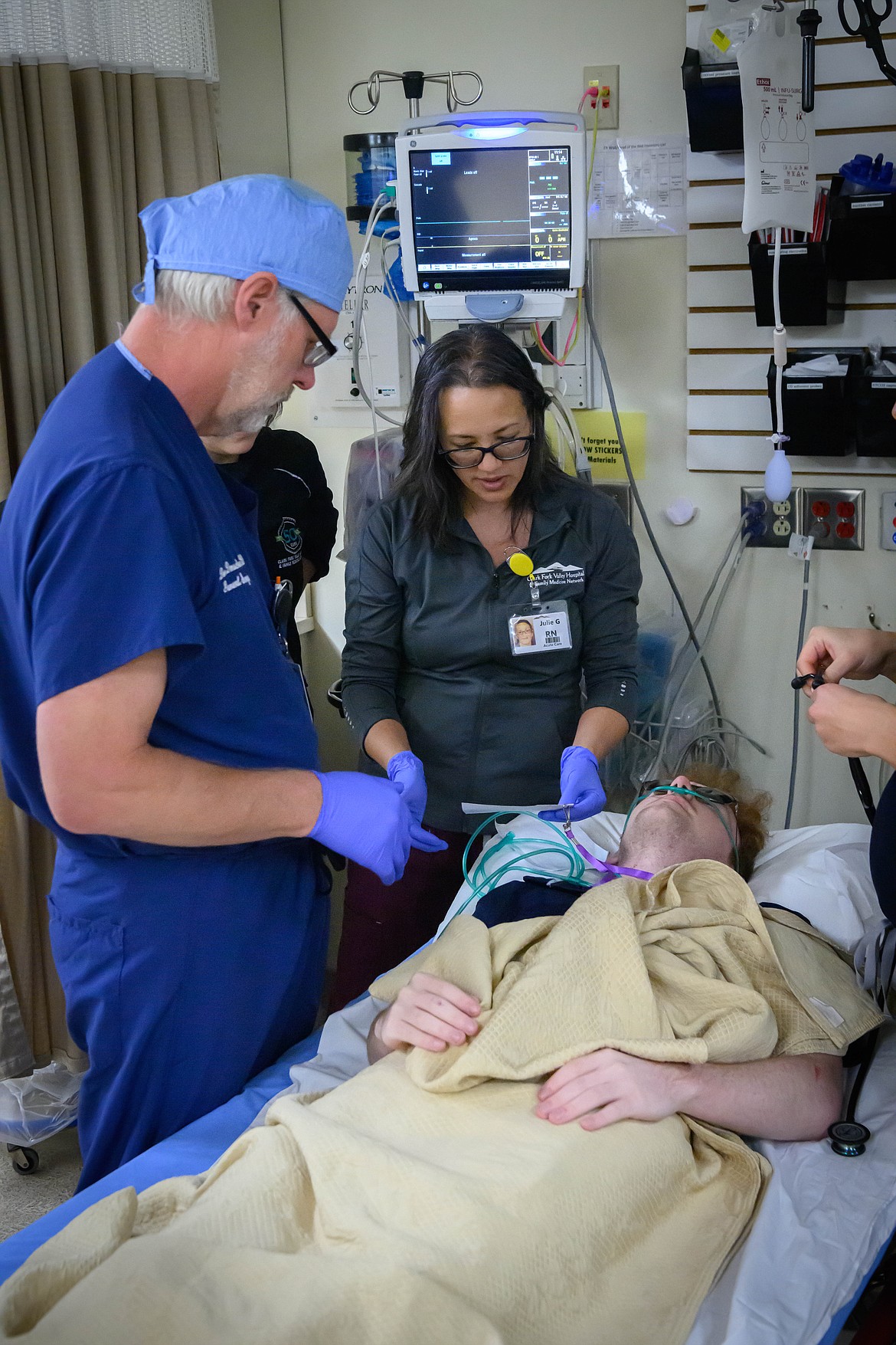 Donald Damschen and Jessica Valentine treat Logan Steineba at the Clark Fork Valley Hospital Emergency Room during the simulated accident. (Tracy Scott/Valley Press)