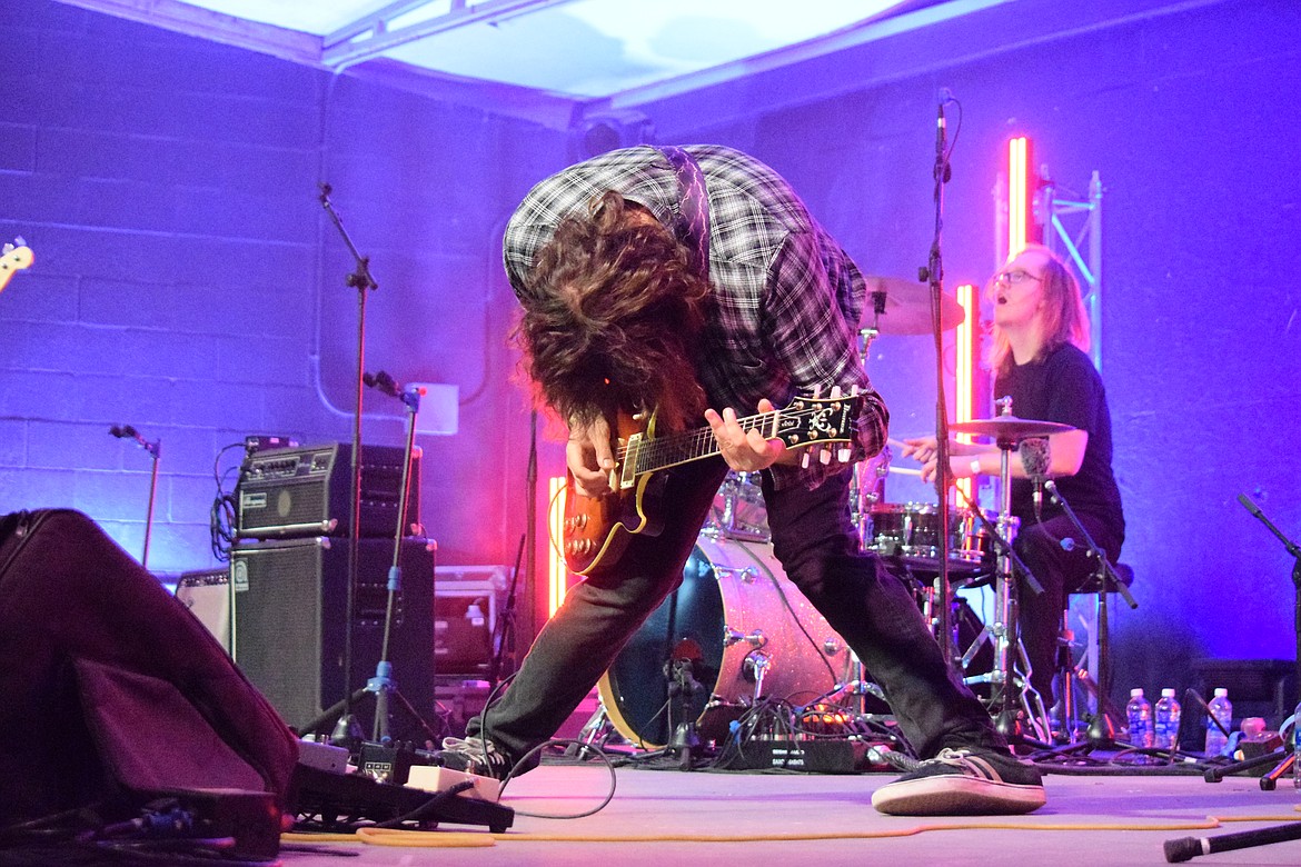 Anthony Medici shreds his guitar on stage at ’90s Flannel Fest during the Superunknown performance, a tribute band to Soundgarden.