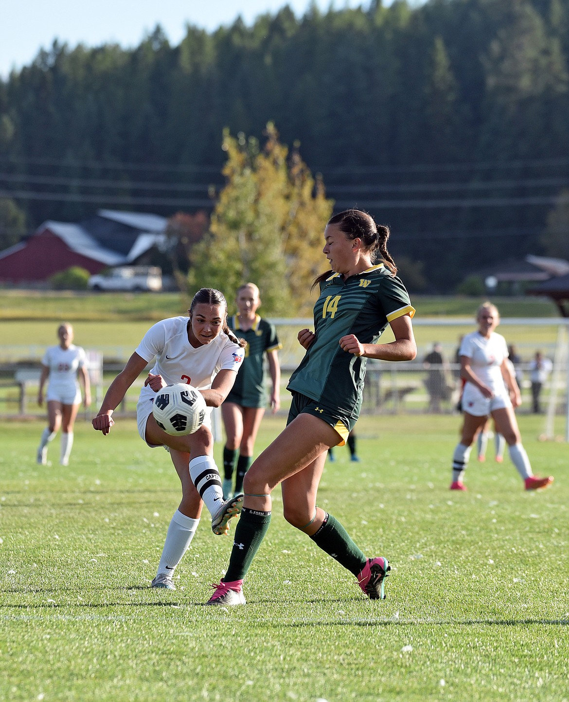 Freshman defender Sage Ordway blocks a pass at the homecoming game last week. (Julie Engler/Whitefish Pilot)