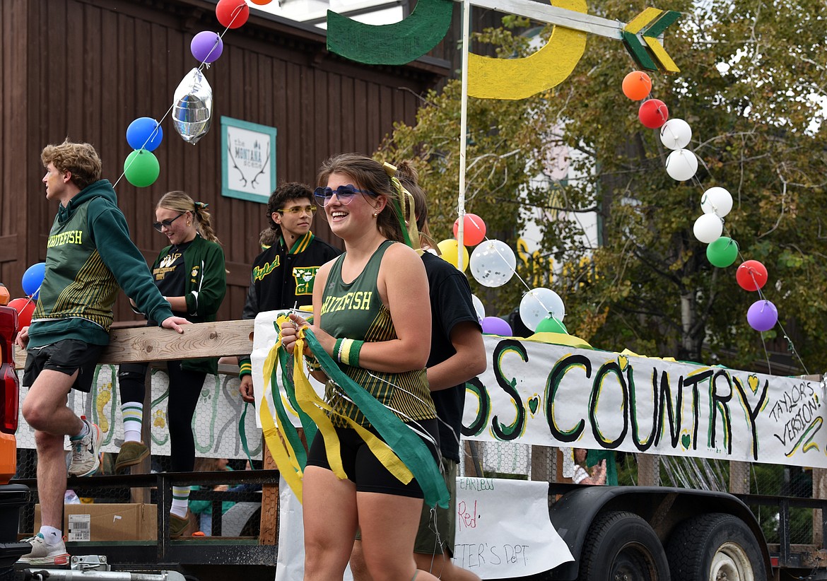 Cross country team members run the streets at the homecoming parade on Friday, Oct. 4. (Kelsey Evans/Whitefish Pilot)