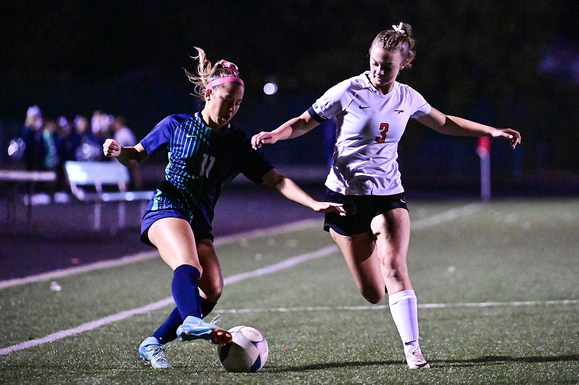 Glacier's Bailee Dahlman (11) and Flathead's Ali Putzler (3) battle for possession in the first half at Legends Stadium on Tuesday, Oct. 8. (Casey Kreider/Daily Inter Lake)