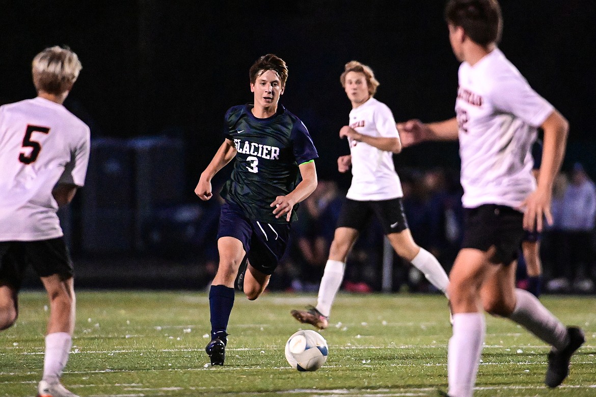 Glacier's Elias Holly (3) pushes the ball upfield in the second half against Flathead at Legends Stadium on Tuesday, Oct. 8. (Casey Kreider/Daily Inter Lake)