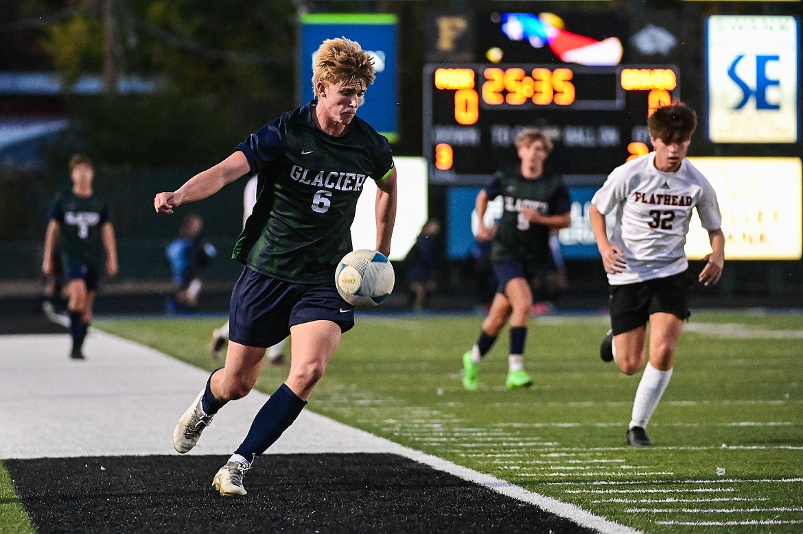 Glacier's Liam Ells (6) pushes the ball upfield in the second half against Flathead at Legends Stadium on Tuesday, Oct. 8. (Casey Kreider/Daily Inter Lake)