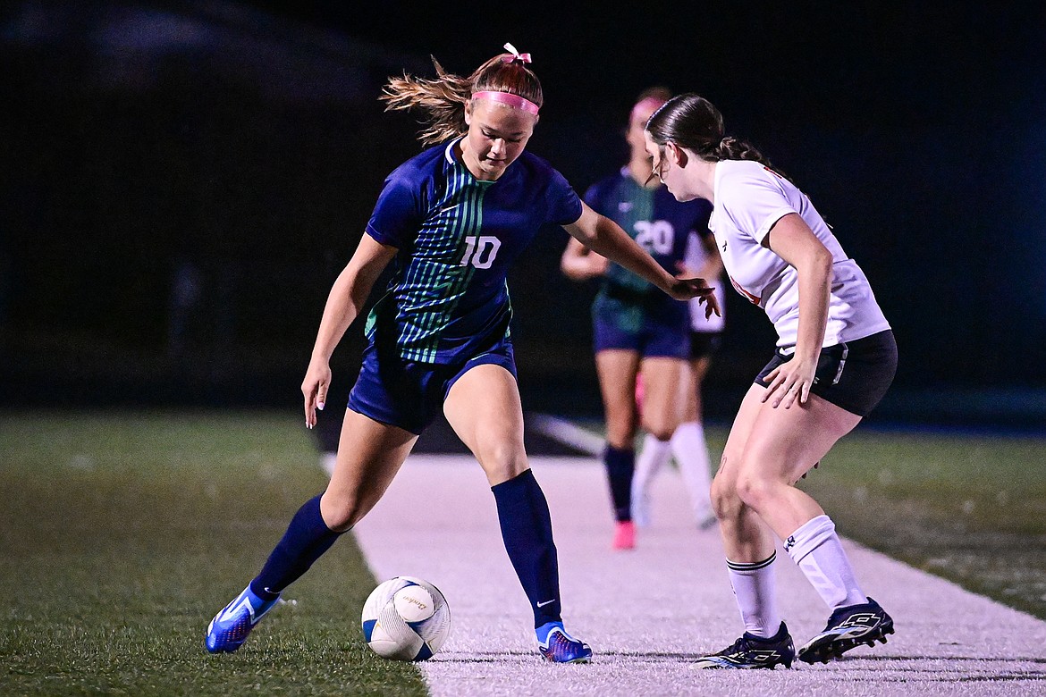 Glacier's Gracie Winkler (10) pushes the ball upfield in the first half against Flathead at Legends Stadium on Tuesday, Oct. 8. (Casey Kreider/Daily Inter Lake)