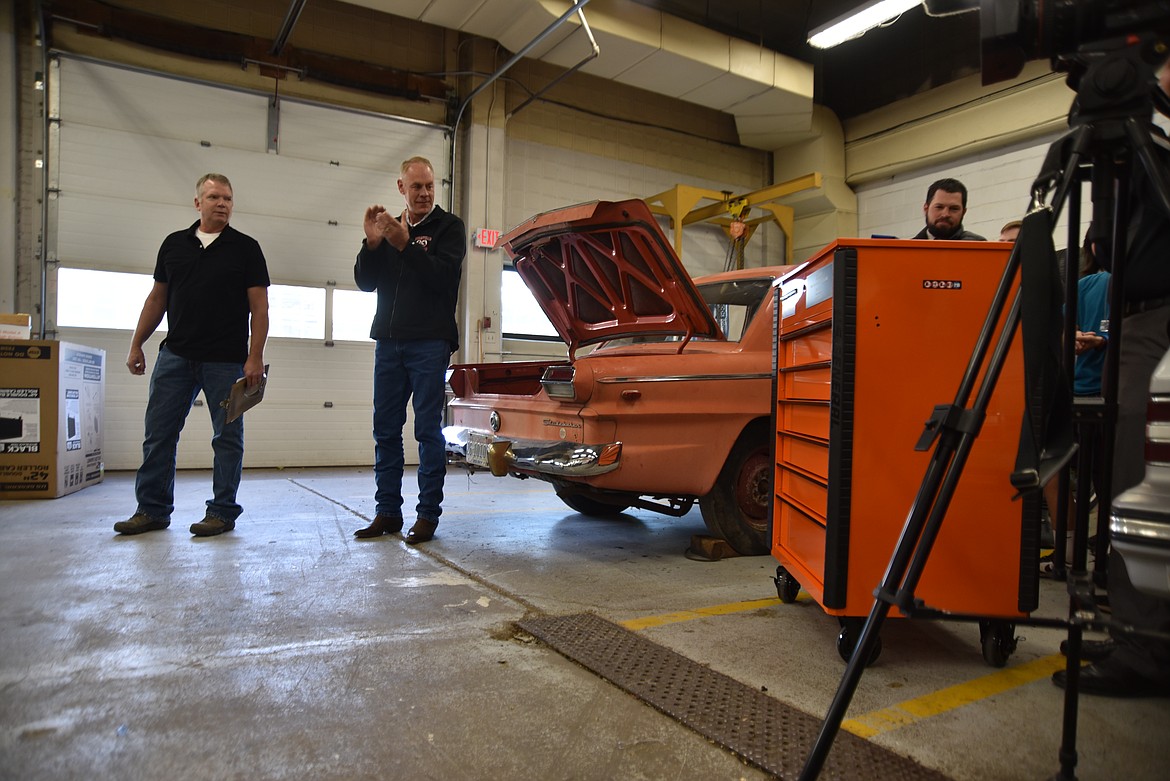 A new U.S. General tool cabinet is unveiled as part of a $50,000 Harbor Freight Tools for Schools prize awarded to Flathead High School automotive teacher Rob Hunter on Tuesday, Oct. 8, 2024, in the auto shop. U.S. Rep Ryan Zinke, right, was in attendance. (Hilary Matheson/Daily Inter Lake)