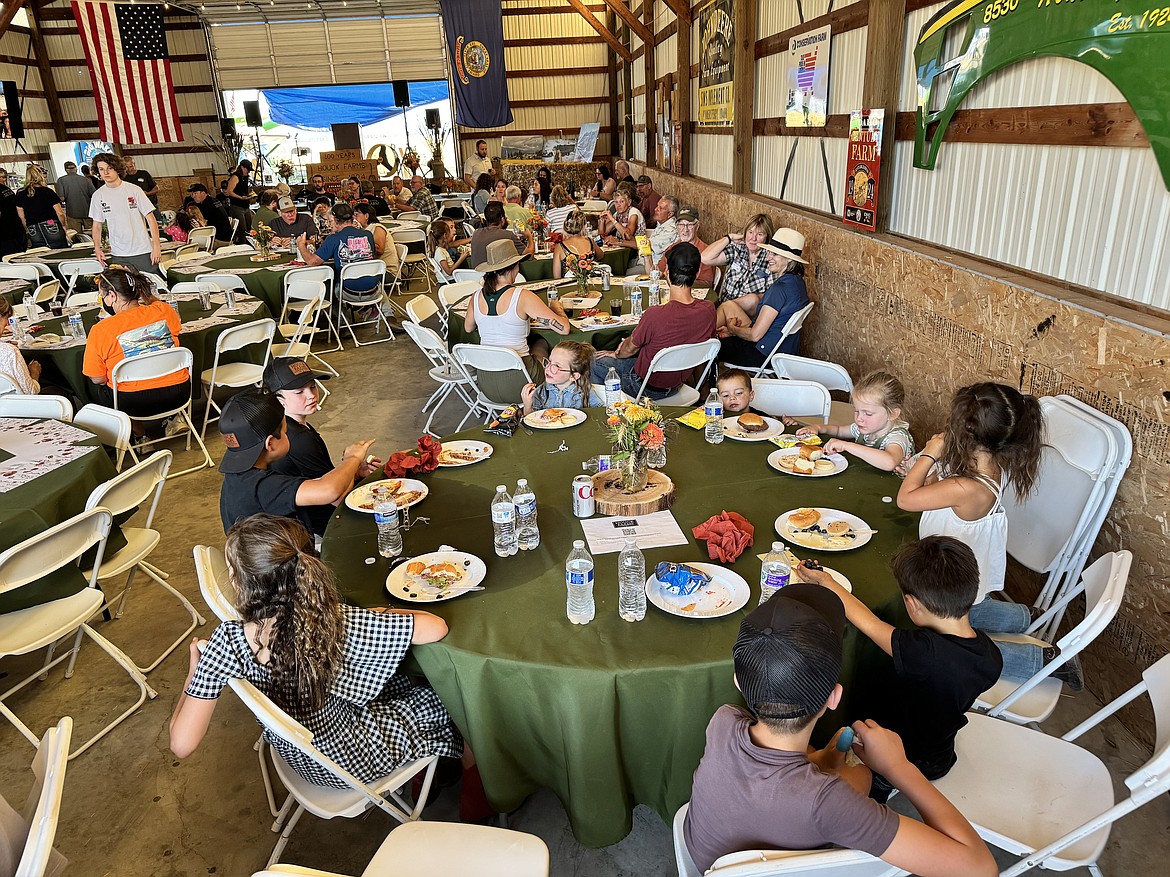 Family members are pictured at a dinner celebrating the farm's centennial.