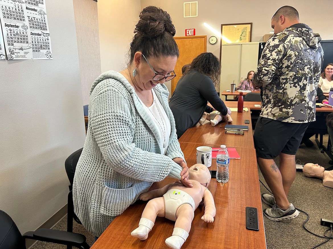 Grant County Health District staff members practiced CPR on an infant manikin.