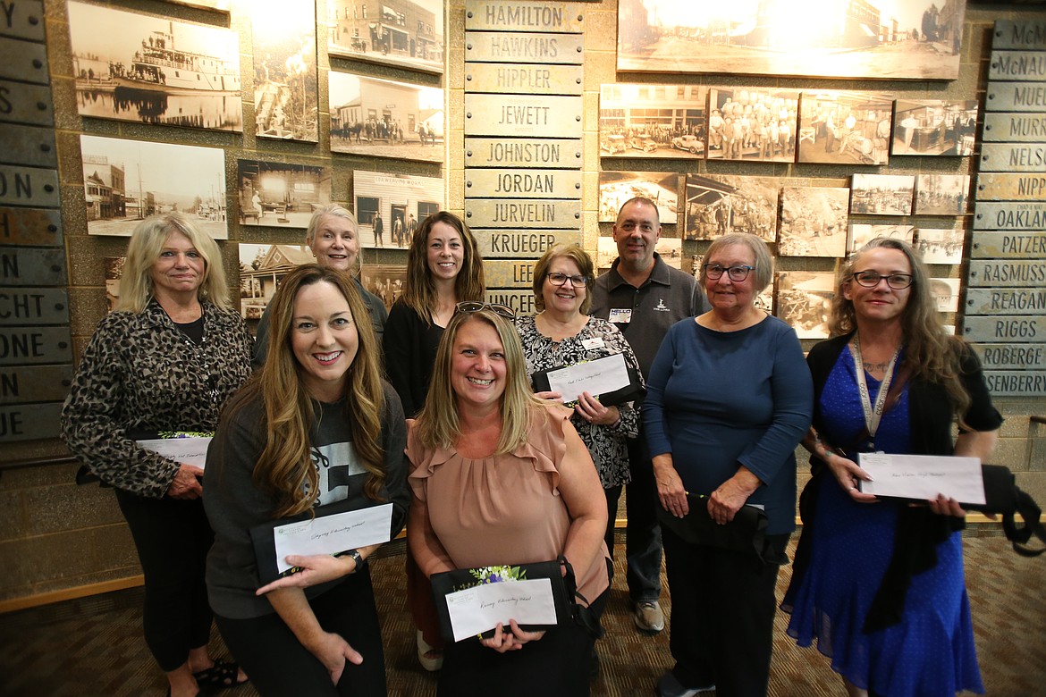 Representatives from local organizations gather Tuesday afternoon in the Community Room of the Coeur d'Alene Public Library to accept donations from the Coeur d'Alene Garden Club, which distributed $13,600 raised during the 2024 Garden Tour in July. Back row, from left: Kristen Neeser, Mayte Eriksson, Kaelynn Woodward, Melanie Droesch, Eric Edmonds, Christie Masters and Wynn Clarke. Front row, from left: Megan Beaudry and Mandi Ferguson.