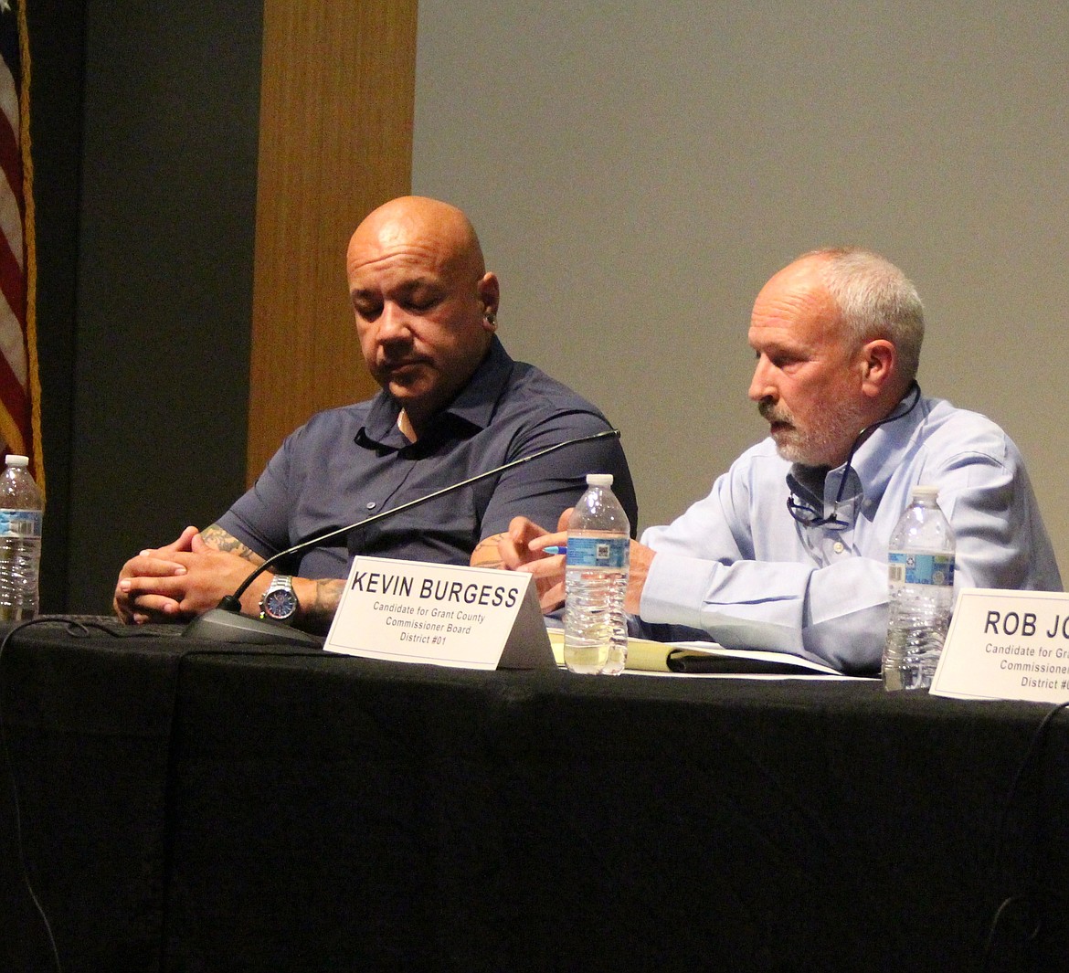 Grant County Commission candidates Amador Castro, left, and Kevin Burgess, right, gave their views on a wide range of topics at a candidate forum Monday night in Moses Lake.