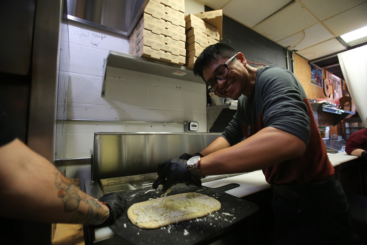 Say cheese! AJ Navales enjoys a work experience Tuesday morning at Wonder Crust Pizza in Coeur d'Alene.