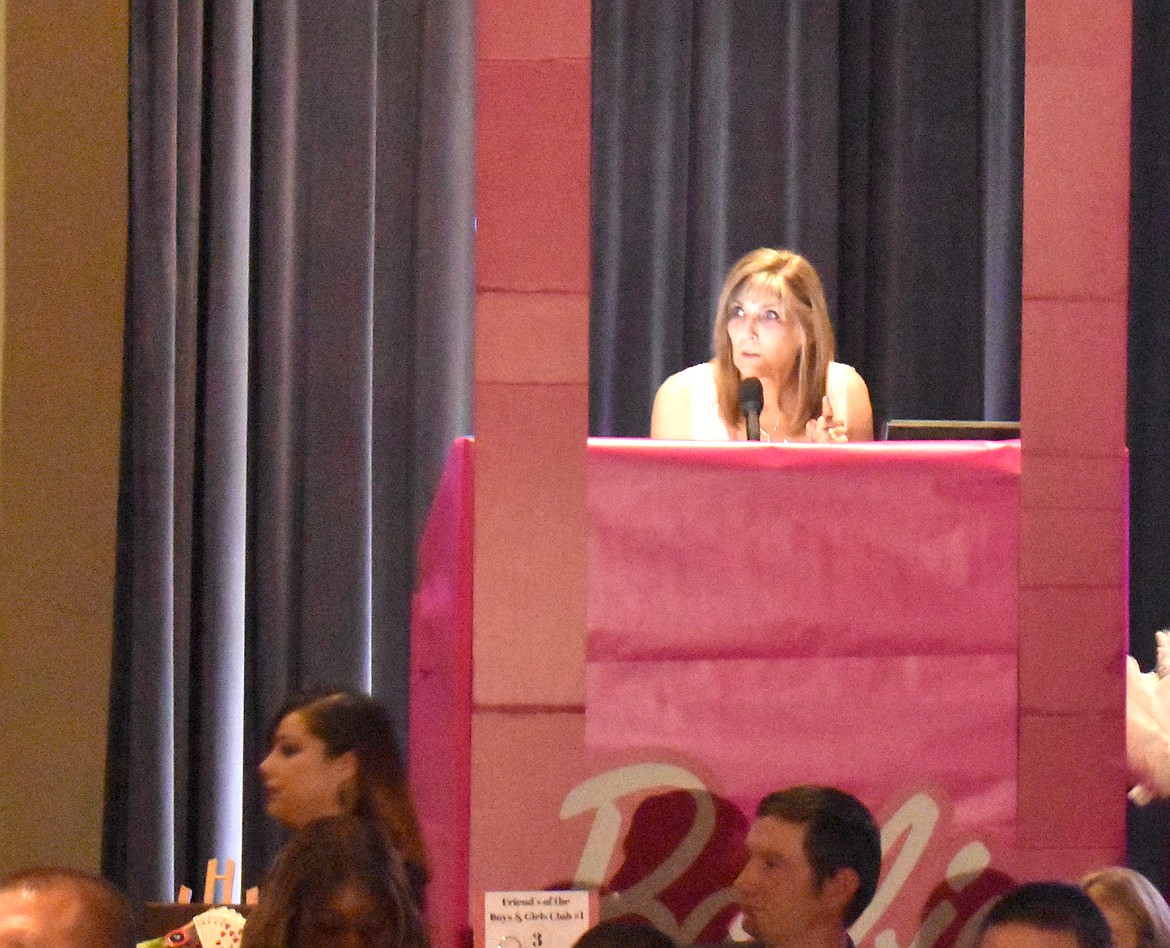 Kim Pope, executive director of the Boys & Girls Clubs of the Columbia Basin, speaks at the club’s fundraiser banquet Saturday. Pope was honored with a major award from the Washington and Alaska clubs and another from the nine-state Pacific Region.