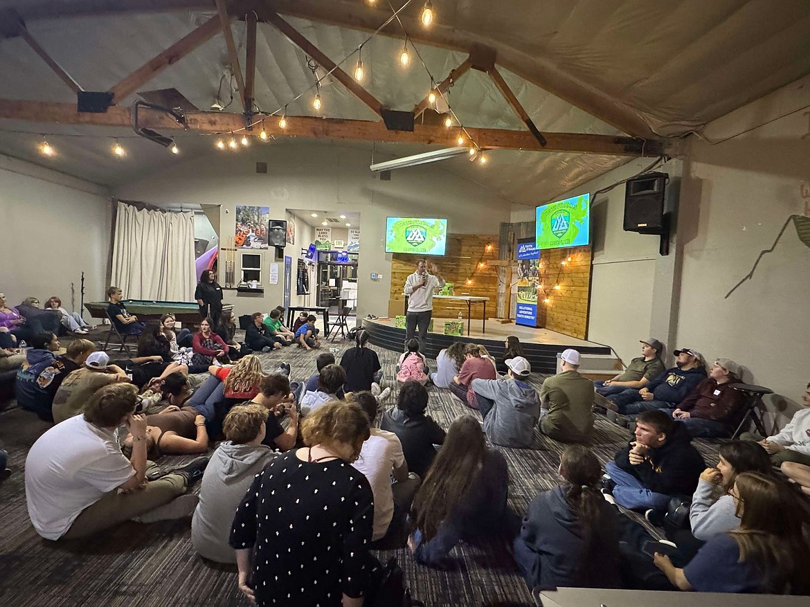 Children hang out and listen to a speaker at Youth Dynamics’ building in Moses Lake. This year’s benefit auction Oct. 19 will fund renovations to the building to give youth even more activities and support.