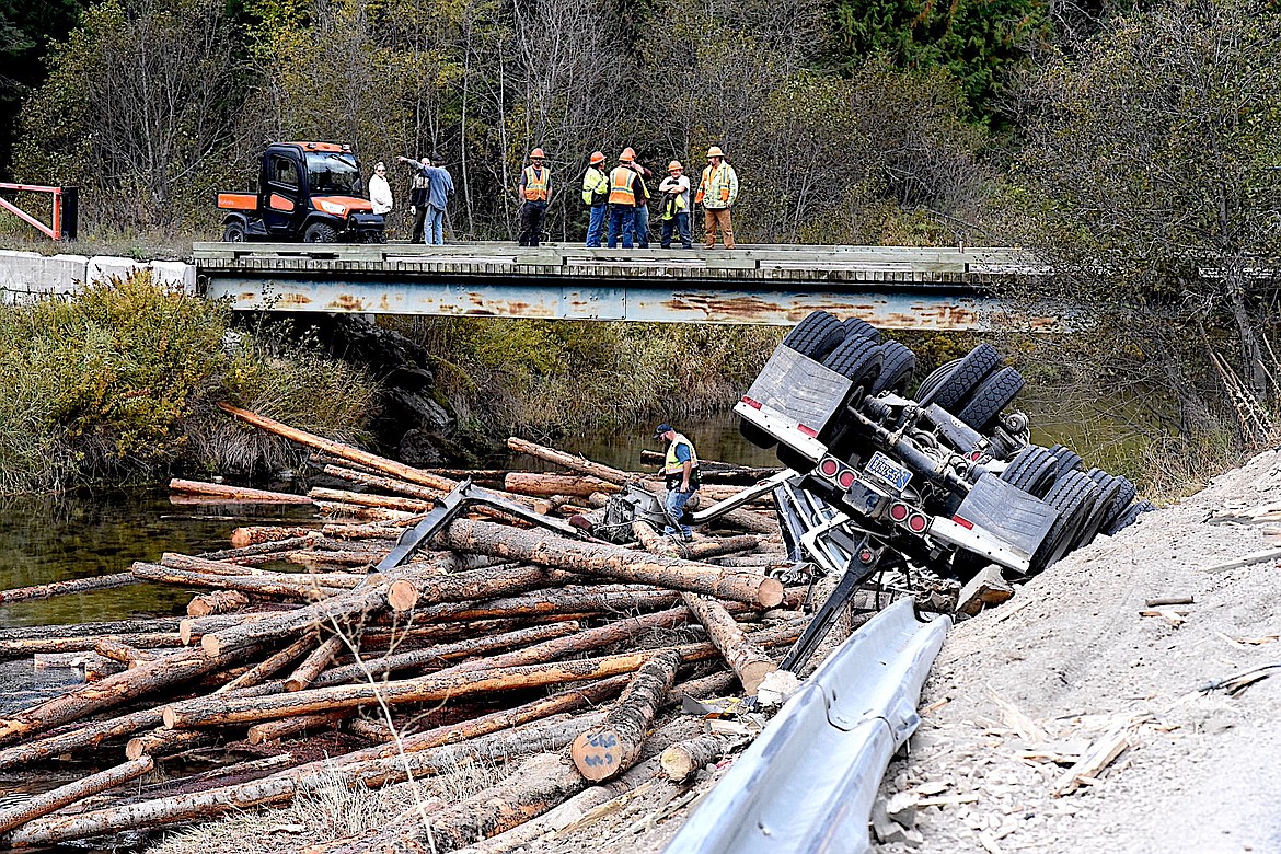 A truck hauling logs north on Highway 56 in Sanders County left the road and crashed Wednesday, Oct. 9, 2024, into the Bull River. (Scott Shindledecker/The Western News)