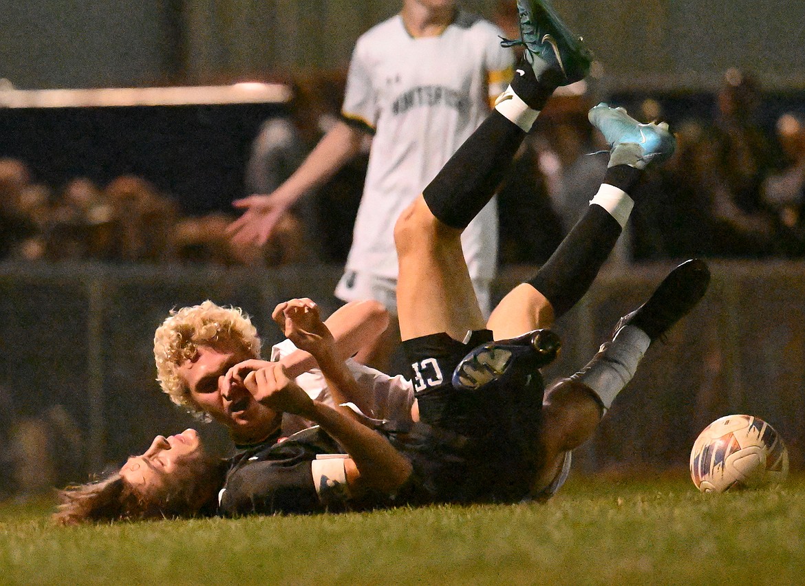 Jack Harris collides with a Whitefish defender.