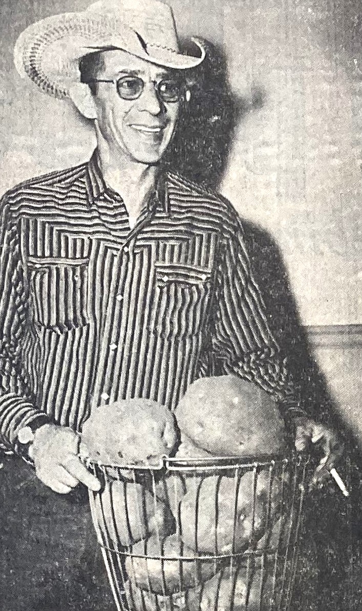 In 1959, Jack Holmes displays famous potatoes from North Idaho.