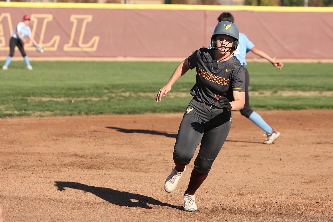 Moses Lake senior Eryn Eckenberg, in grey, races toward third base during Tuesday’s doubleheader against West Valley (Yakima). Eckenberg went three-for-four at the plate with four RBI in the first game on Tuesday.