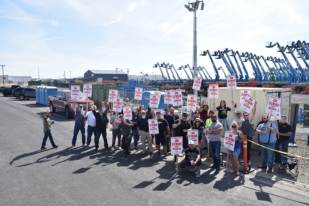 Employees of Boeing strike outside of the main gate of the Moses Lake facility Sept. 14.