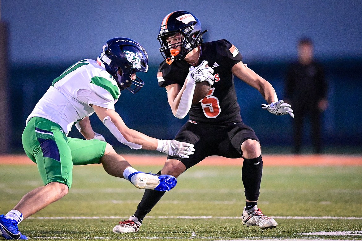 Flathead wide receiver Kaleb Sims (5) picks up yardage after a reception in the first quarter against Glacier at Legends Stadium on Thursday, Oct. 10. (Casey Kreider/Daily Inter Lake)