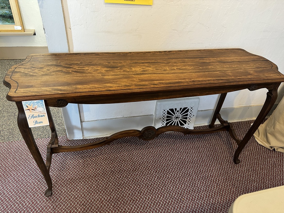 This classic wooden table is one of the items donated for the Old Hotel benefit auction Saturday at Sacred Heart Catholic Church in Othello.