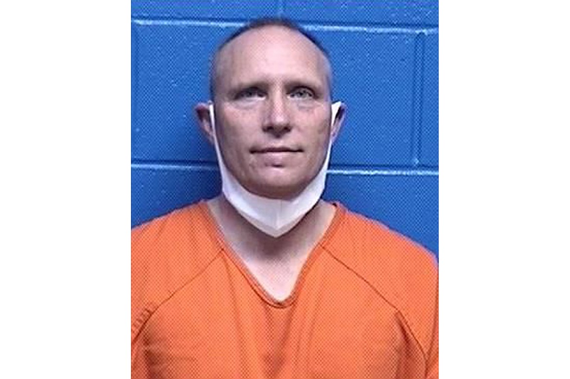 This booking photo released by the Missoula County, Mont., Detention Facility shows Henry Phillip Muntzer on Jan. 18, 2021. (Missoula County Detention Facility via AP, File