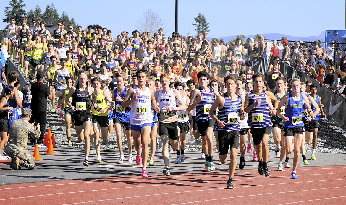 Photo by GEORGE ROHLINGER
Coeur d'Alene boys cross country runners Wyatt Carr, Max Cervi-Skinner and Zack Cervi-Skinner look to break away from the pack in the Nike Hole in the Wall Invitational on Saturday at Lakewood High in Arlington, Wash.