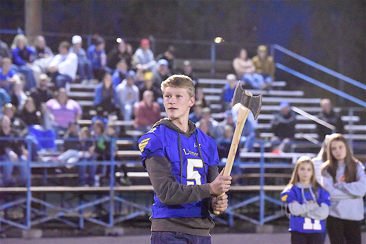 Libby Loggers quarterback Tristan Andersen prepares to compete in the ax throwing event Thursday, Oct. 10, 2025, during Libby Homecoming festivities. (Scott Shindledecker)
