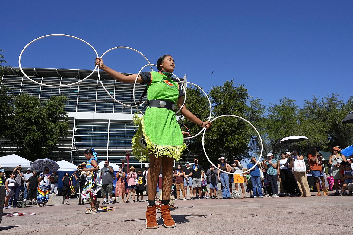 Performers from the Native American Hoop Dance of Ballet Arizona dance at an Indigenous Peoples Day festival, Oct. 9, 2023, in Phoenix. (AP Photo/Ross D. Franklin, File)