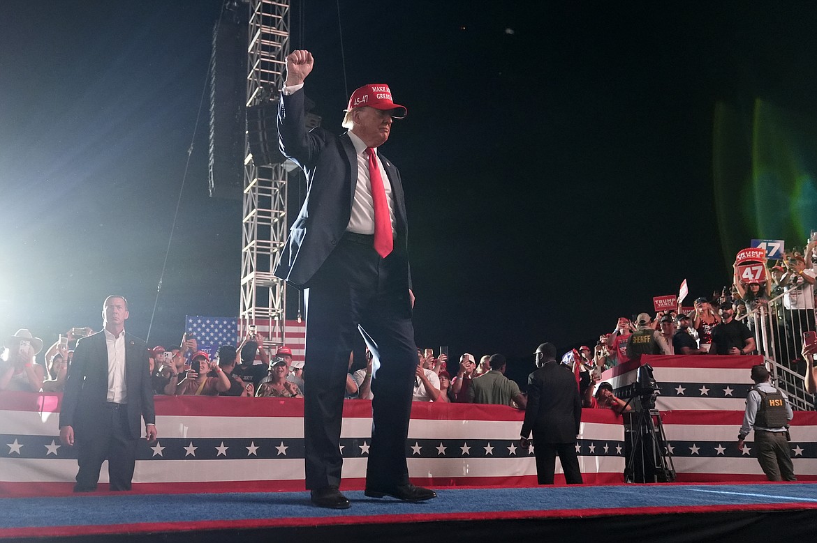 Republican presidential nominee former President Donald Trump gestures to the audience as he departs a campaign rally at the Calhoun Ranch, Saturday, Oct. 12, 2024, in Coachella, Calif. (AP Photo/Alex Brandon)