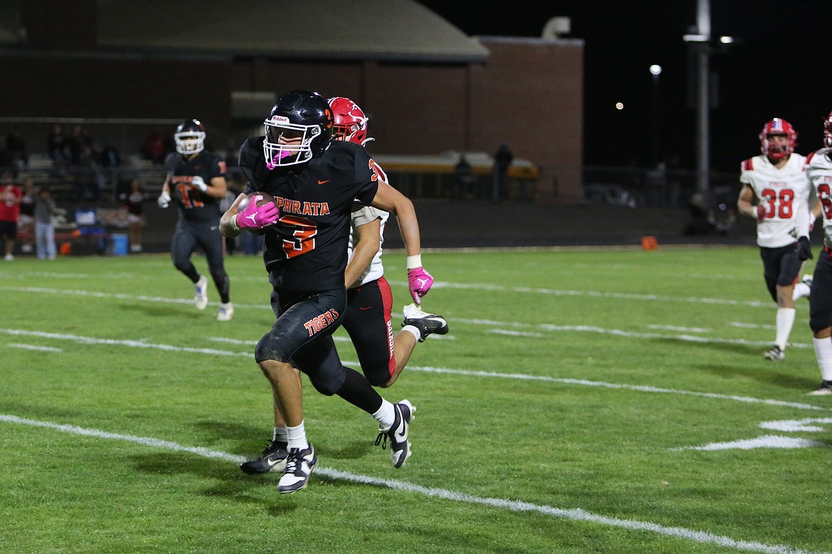 Ephrata senior Coltyn Klingenberg (3) races past the Othello defense on a 40-yard catch-and-run in the third quarter on Saturday.