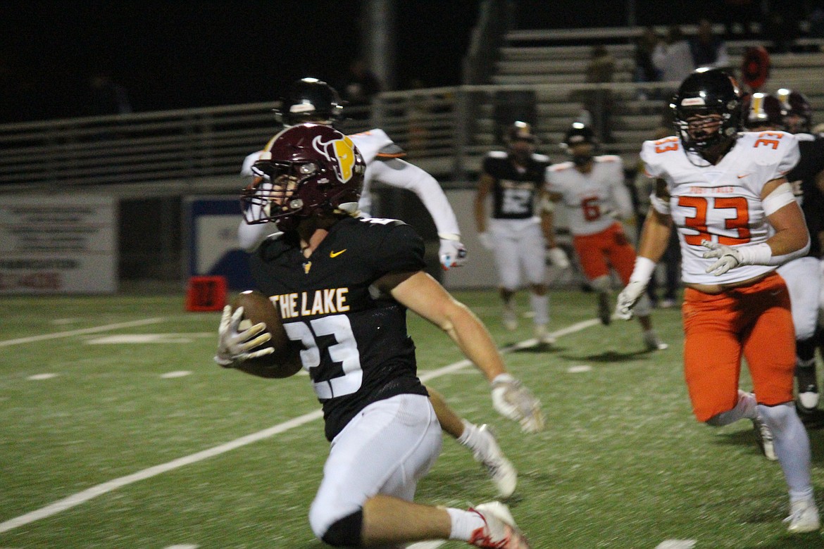 Moses Lake sophomore Elijah Burns turns upfield with the ball against Post Falls, Idaho Friday night. Burns caught 14 passes for 151 yards in the win, adding 75 yards and a touchdown on the ground.