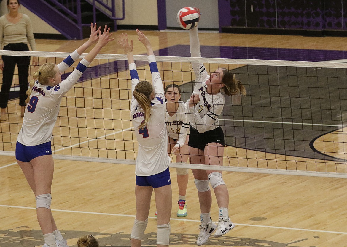 Polson's Josie Hendriksen executes a kill during last Thursday's take-down of Columbia Falls. (Bob Gunderson photo)