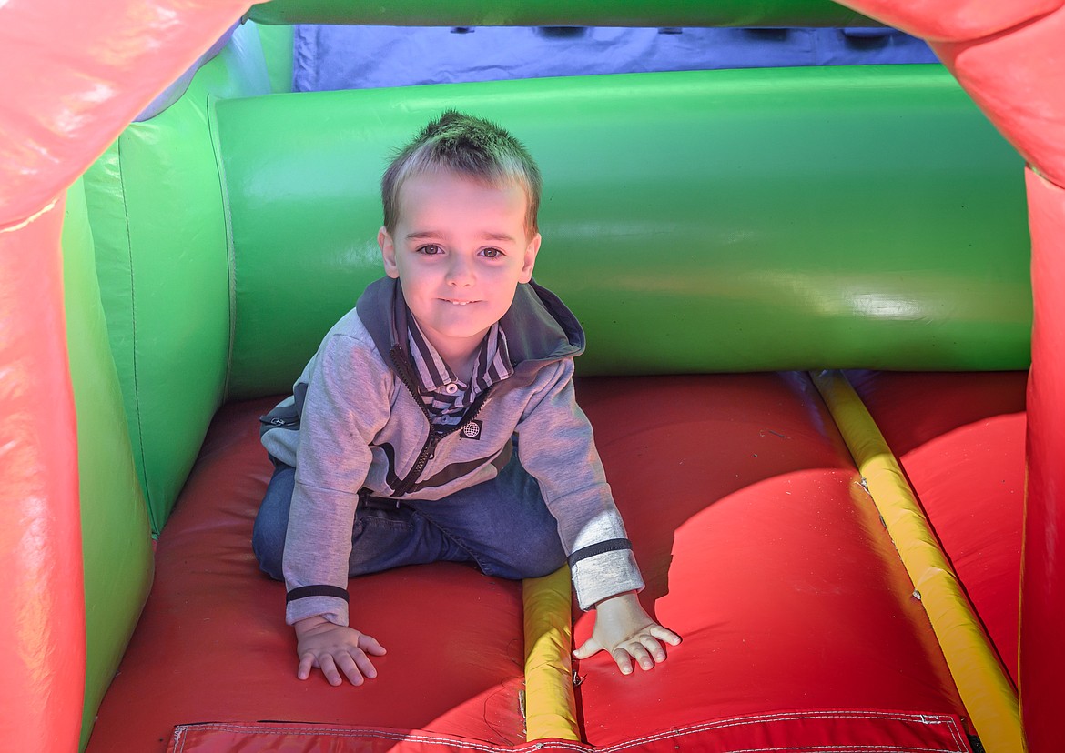 3-year-old Nathan Hewlett enjoys the bounce house. (Tracy Scott/Valley Press)