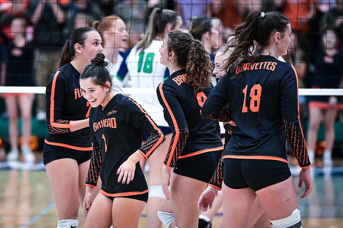 Flathead's Tailyr Reece (1) smiles as she leaves the Bravettes huddle during a match against Glacier at Glacier High School on Tuesday, Oct. 15. (Casey Kreider/Daily Inter Lake)