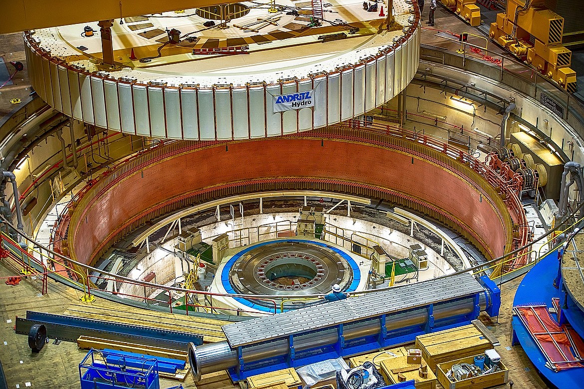 A refurbished rotor is placed inside the G22 generator at Grand Coulee Dam. This was the final of three generators to go back online after the dam’s overhaul project began at the site in 2013. The Bonneville Power Administration is continuing to work to enhance the power grid in the Pacific Northwest with various projects proposed in Washington and Oregon.