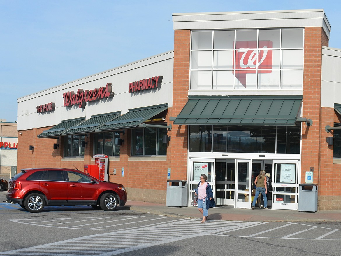 Customers leave the Coeur d'Alene Walgreens Pharmacy location Tuesday afternoon. The pharmacy chain just announced their intention to close about 1,200 locations.