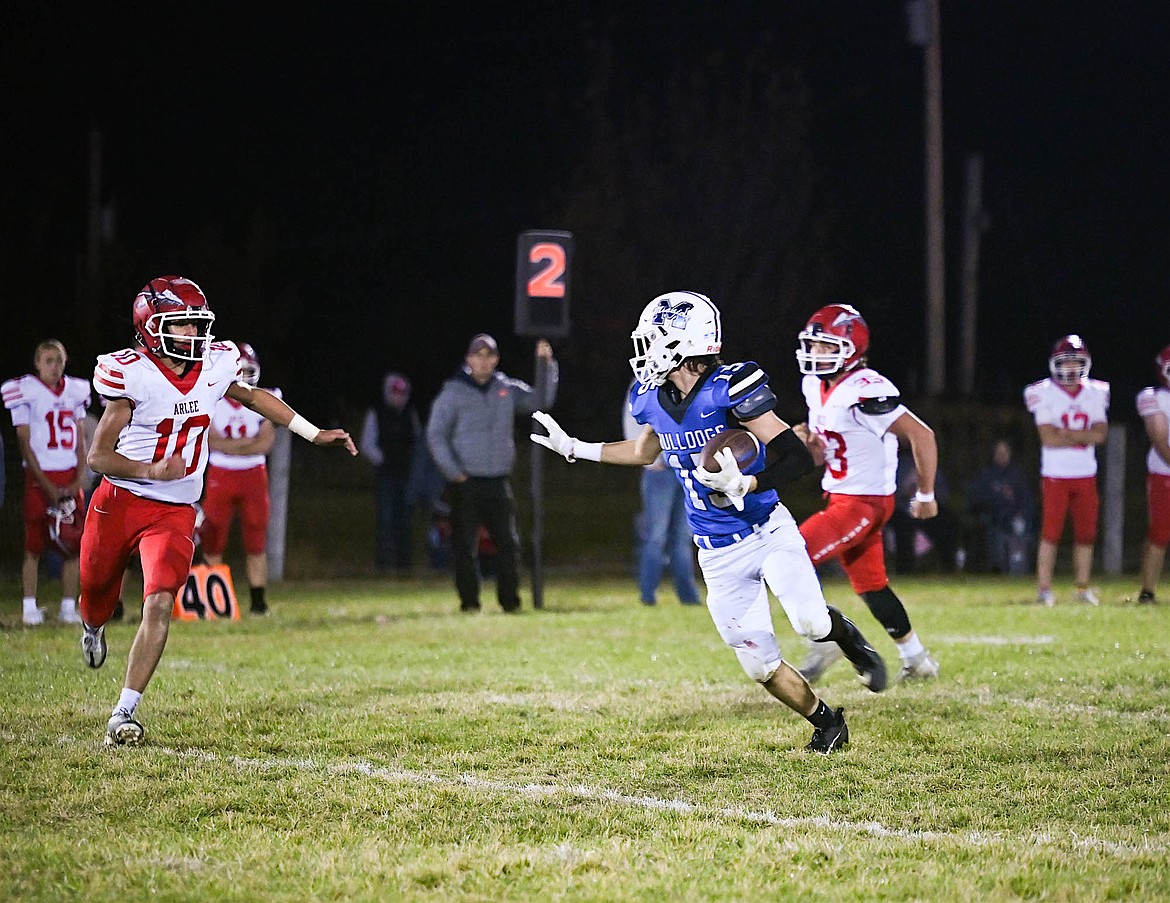 Bulldog Titan Mansell heads down the field during last Friday's game against the Arlee Warriors. (Christa Umphrey photo)