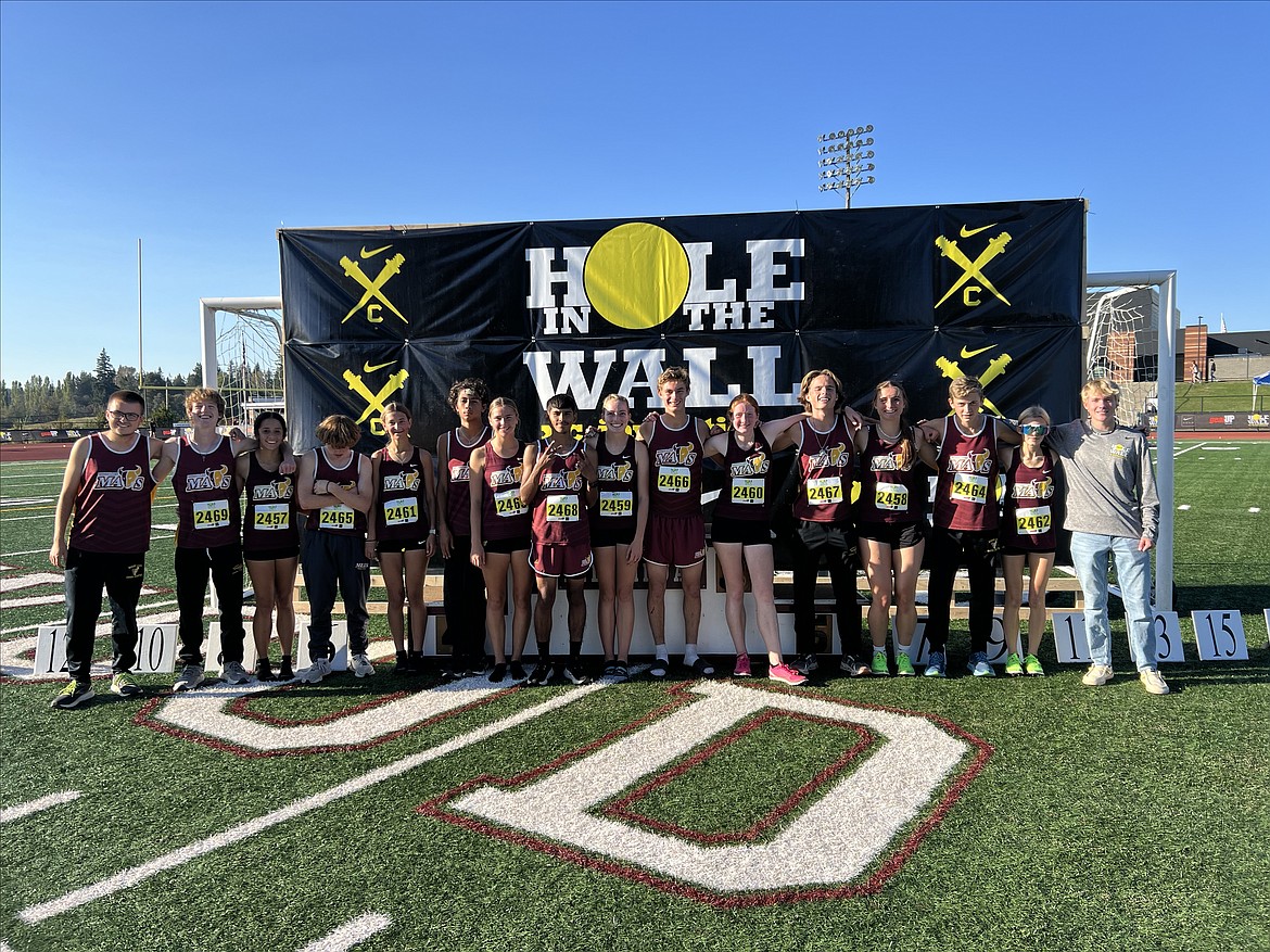 Runners for the boys and girls Moses Lake cross country teams pose for a photo at the Nike Hole in the Wall meet in Lakewood on Saturday. The girls team took second out of 27 teams in the Varsity Silver division.