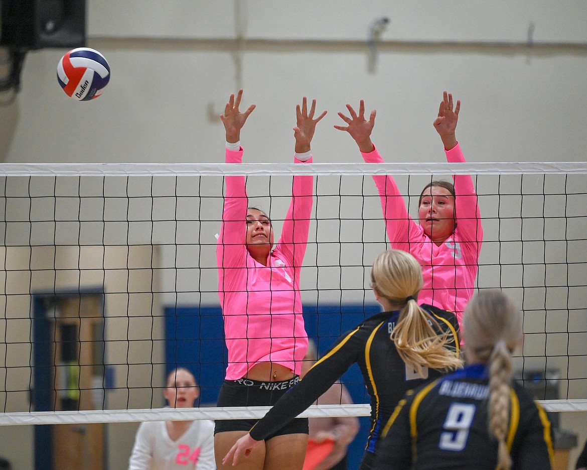 Lady Bulldogs Cora Matt and Maia Christopher prepare to block Thompson Falls during volleyball action last week. (Christa Umphrey photo)