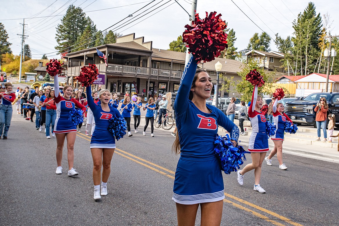 Bigfork High School cheerleaders lead the Homecoming parade downtown Friday, Oct. 11. (Avery Howe/Bigfork Eagle)