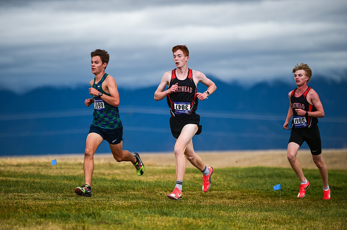 Glacier's Gabe Ackerly and Flathead's Kasen Kastner and Brodyn DeShaw placed fourth, third and fifth at the Glacier Invite at Rebecca Farm on Wednesday, Oct. 16. (Casey Kreider/Daily Inter Lake)