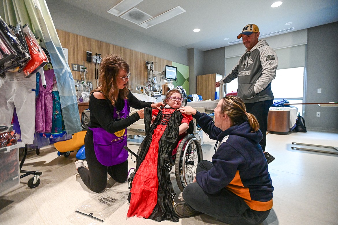 Finnley Foster tries on a vampiress costume with her father Pat, step-mother Victoria and Logan Health Children's Child Life Supervisor Amy Rohyans Stewart at the hospital's Spirit of Children event held in coordination with Spirit Halloween on Wednesday, Oct. 16. In the past five years, Spirit of Children has raised $119,403 for Logan Health Children’s. (Casey Kreider/Daily Inter Lake)