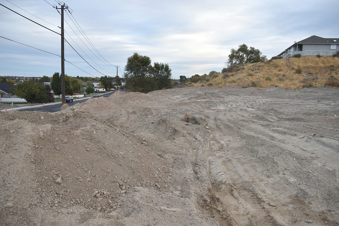 The land being developed by Sapphire Homes Northwest in Moses Lake is a steep hillside that will need leveling, but it also offers lake views, said owner Troy Schmeil.