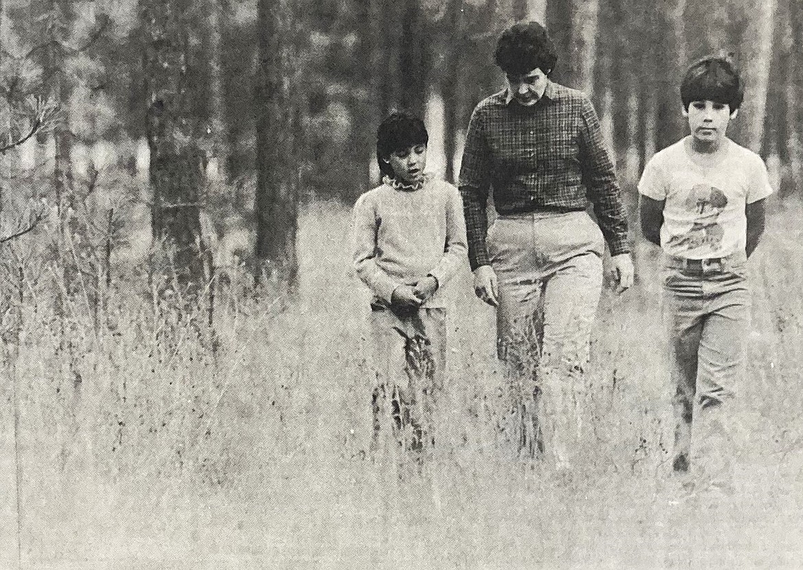 In 1984, Linda Desouza and her children, Robin and Chris, walk through a proposed landfill site.