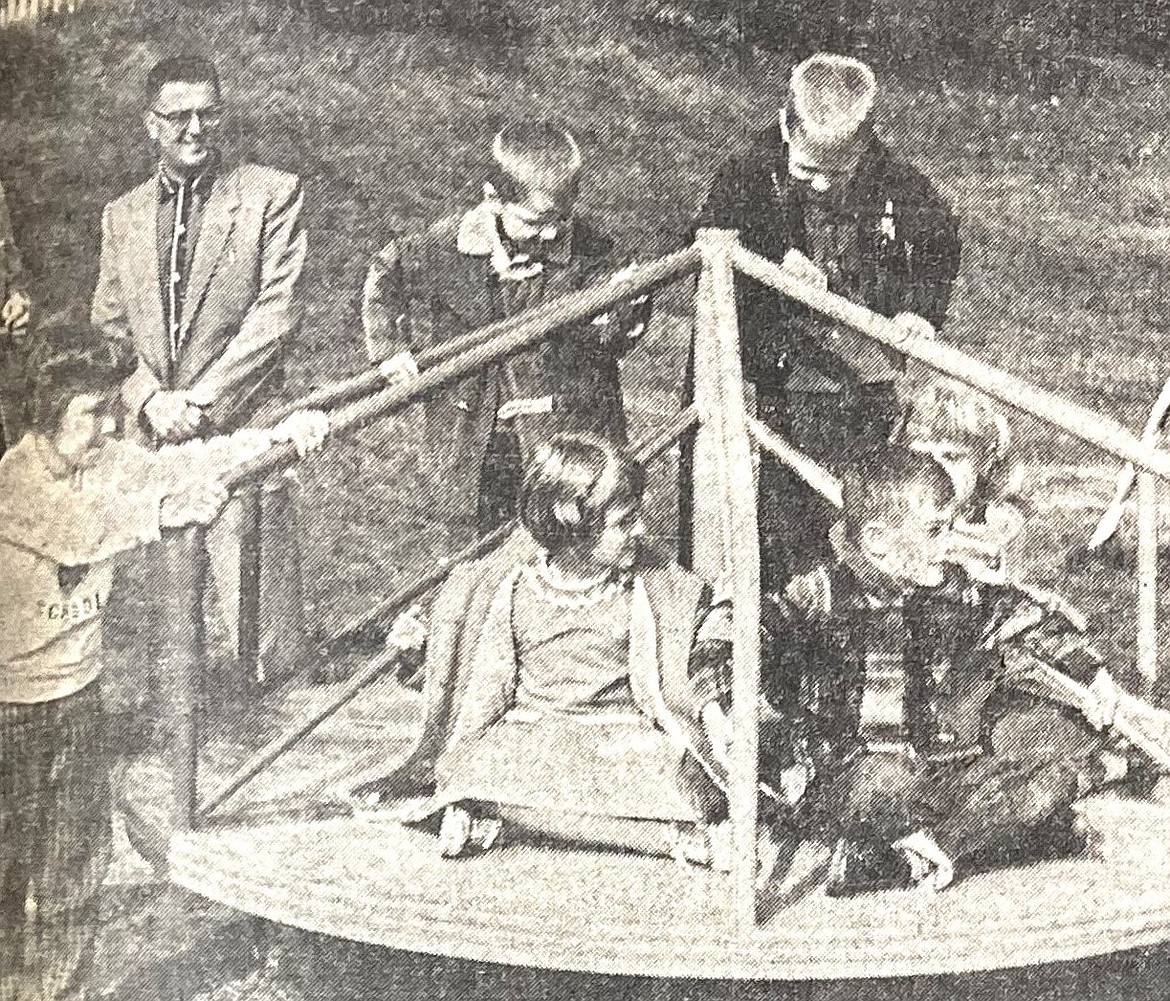 In 1959, Bryan School children initiate The Whirl, including Sheila Nelson, left; seated from left, Debbe Ann Pumajevich, Robert McCold and Jamie Kohler; and standing, Bobby Olson and Mark Johnson. Red Halpern, city parks and rec director, stands in the background.