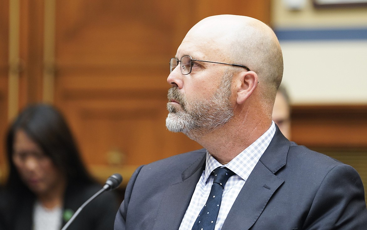 Ryan Busse, senior advisor at Giffords Law Center, listens during a House Committee on Oversight and Reform hearing, July 27, 2022, on Capitol Hill in Washington. (AP Photo/Mariam Zuhaib, File)