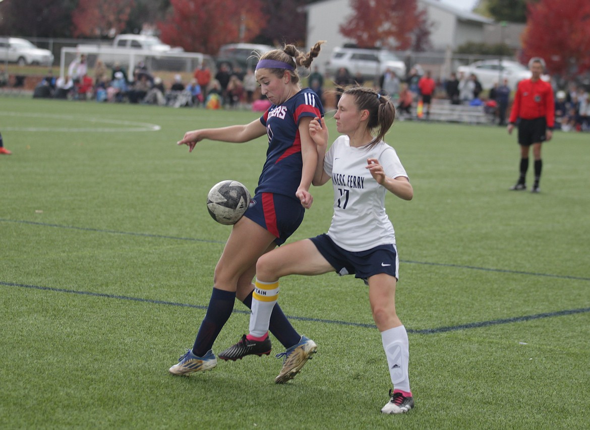 JASON ELLIOTT/Press
Coeur d'Alene Charter senior defender Lydia Lehosit attempts to make a move on Bonners Ferry senior Leena Teele during the first half of Wednesday's 4A District 1-2 girls soccer championship match at The Fields in Post Falls.