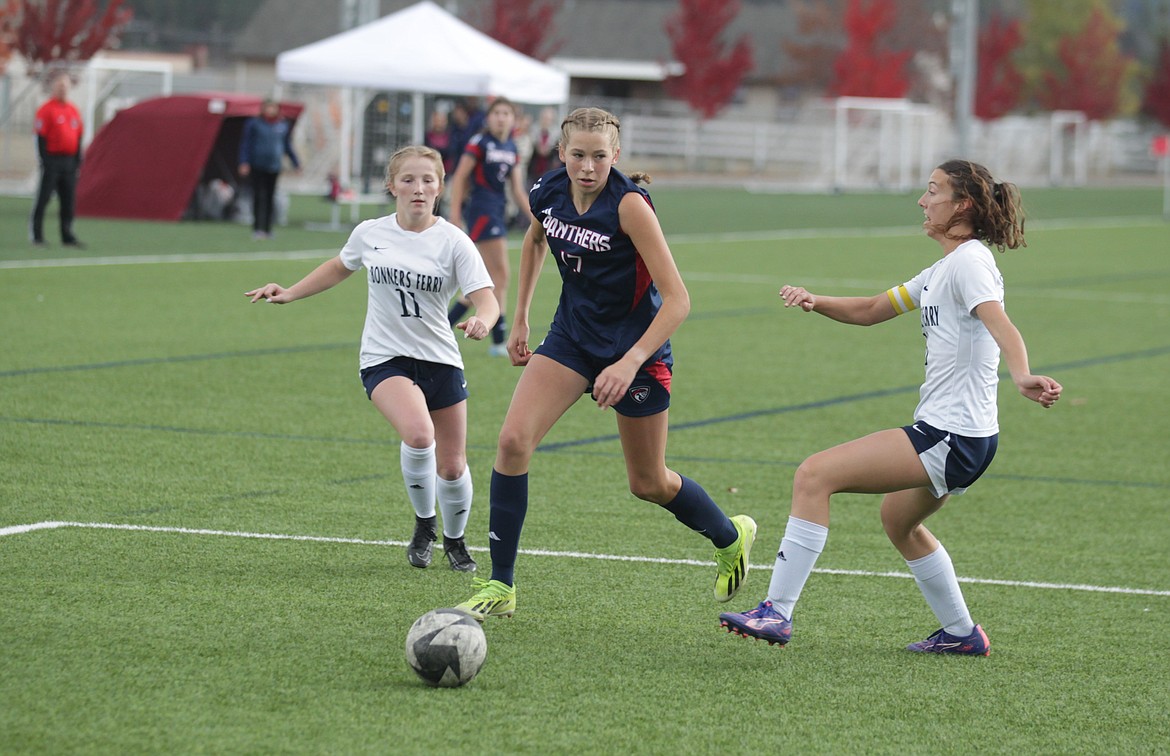 JASON ELLIOTT/Press
Coeur d'Alene junior forward Reagan Meine splits the Bonners Ferry defense of Nevaeh Therrian (11) and Leena Teele (17) during the first half of Wednesday's 4A District 1-2 girls soccer championship match at The Fields in Post Falls.