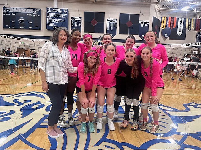 Members of the Bonners Ferry High volleyball team pose for a team picture during the Lady Badgers' Volley for a Cure game on Thursday. Back row, from left are head coach Cynthia Cummings, Eva Willis, Rylie Kimball, Kimberly Lucas, Alison Williams and Helene Rae. Front row, from left are Ellie Falck, AdleeMae Robles, Makenna Sandel and Taren Bateman. Not pictured is Aspen Graham.